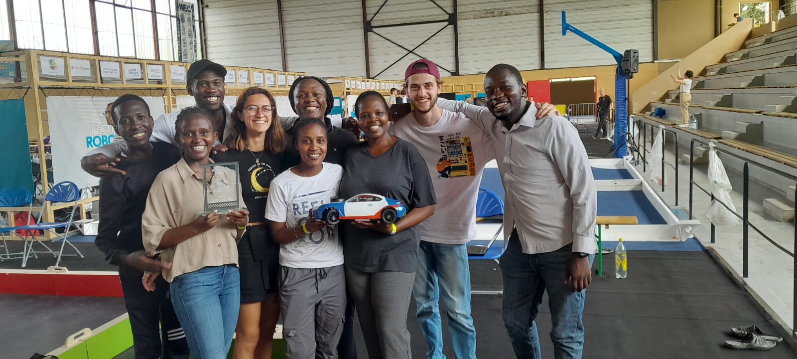 From left to right, School of Mechanical (Back row: David Onyango, Wickliffe Akaka, Allan Makwaka & Staff member, Mr. Pascal Aloo to the far right). From School of Electrical & Electronics Engineering (Front row: Anna Kamene, Elsy Ntinyari & Staff member, Dr.  Ahuna). Other two members in the photo were participants from another participating university in France.