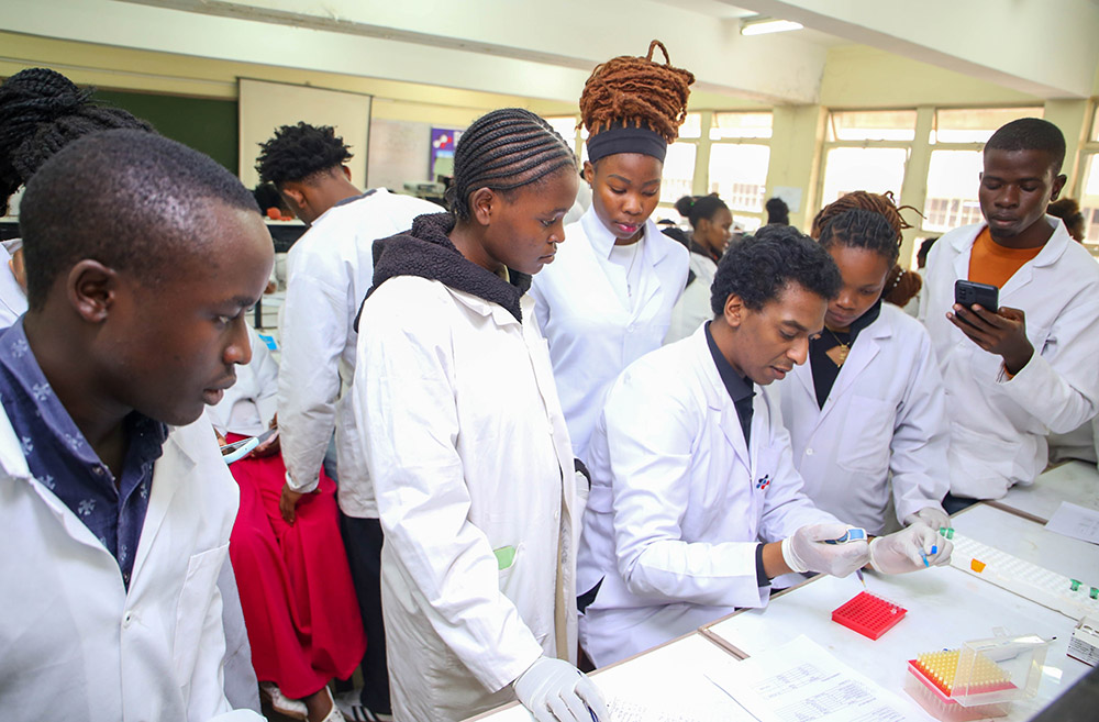 Dr. Osama Ismail from REME-D guiding students through laboratory procedures.